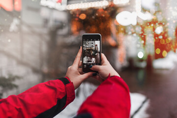person taking a photo of a phone