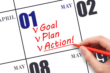 Hand writing text GOAL PLAN ACTION on calendar date May 1. Motivation for a new day. Business...