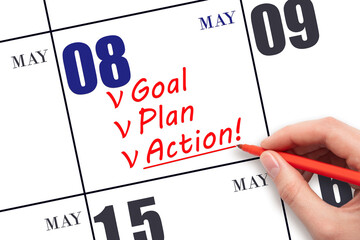 Hand writing text GOAL PLAN ACTION on calendar date May 8. Motivation for a new day. Business...