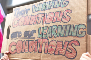 A protest sign in support of education workers
