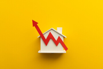 Rising cost of living. Mortgage inflation rates increase. House with a red up arrow