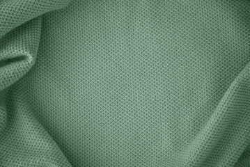 Texture of knitted fabric in trendy turquoise mint color