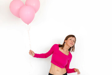 Woman with pink balloons on white background