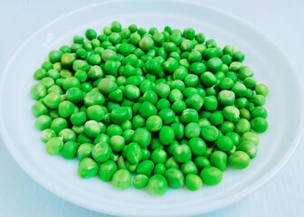 Green Peas legume raw pea fresh matar vegetable food Pisum sativum  P. sativum edible Erwt-petit Pois Erbse Pisello closeup view image stock photo