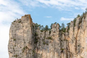 Big cliff from hiking trail on the corniches of Causse Mejean above the Tarn Gorges.