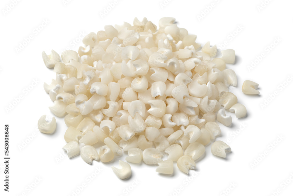 Wall mural heap pf dried white corn seeds isolated on white background close up