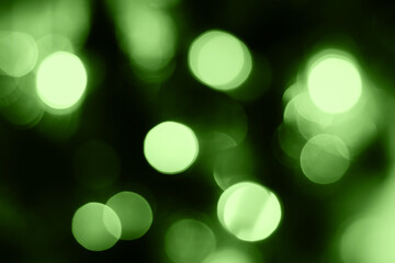 Obraz premium Blurred lights, green background. Abstract bokeh with soft light