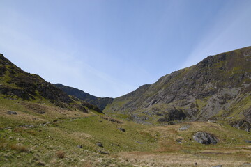 Fototapeta premium a view looing down in the crater of Cadair Idris with a mountain view behind it