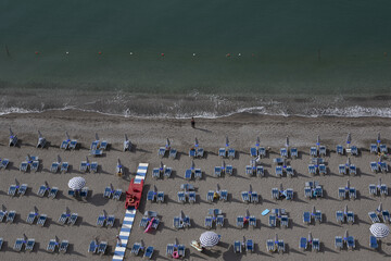 View of umbrellas, beach and sea. The Italian summer begins. Costiera Amalfitana, near Naples, Rome, Italy Europe. Holiday Begin