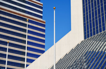 Modern skyscrapers against a bright blue sky