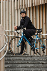 Urban gravel bike cyclist training in winter. Active lifestyle.