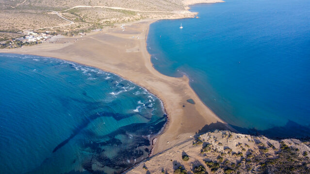 Aerial birds eye view drone photo Prasonisi on Rhodes island, Dodecanese, Greece. Panorama with nice lagoon, sand beach and clear blue water. Famous tourist destination in South Europe