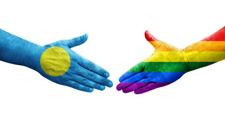 Handshake between LGBT and Palau flags painted on hands, isolated transparent image.