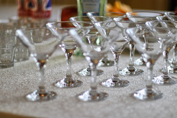 Cocktail glasses are displayed on the buffet table.