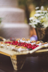 chocolate candies with cherry and walnuts