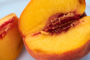 ripe beautiful delicious peach with a huge bone juicy flesh