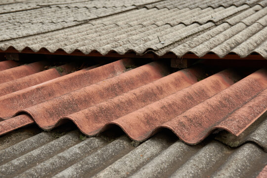 rusty sheet roof, corrugated rooftop coating. metalwork of the roof that can be used to represent galvanized metal maintenance