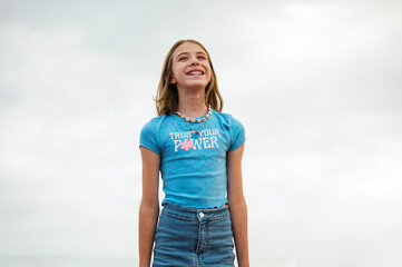 The little girl very happy relaxed in nature.