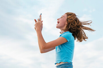 The euphoric girl who writes on a smartphone.