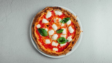 Top view of a pizza Margherita on a table