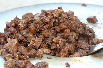 A close up view of Stewed chicken liver withspices on it, a traditional home made delicious liver dish