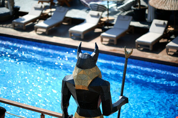 a defender's figure with a spear to guard the pool and recreation area