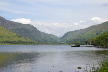 a view of tal-y-llyn lake looking over to the valley in the background