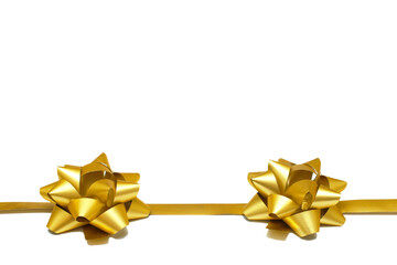 Two golden gift bows with a ribbon on a white background with copy space. isolated object....