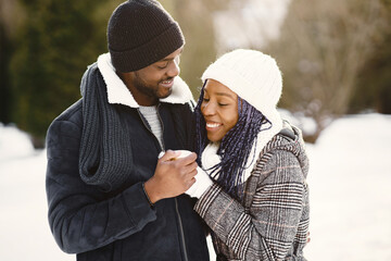 African american couple in a winter forest