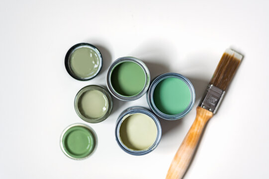 Tiny Sample Paint Cans During House Renovation, Process Of Choosing Paint For The Walls, Different Green Colors, Color Charts On Background