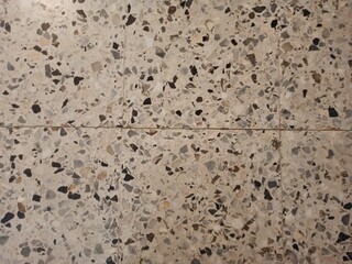 Textured background of tiles on the floor of a house