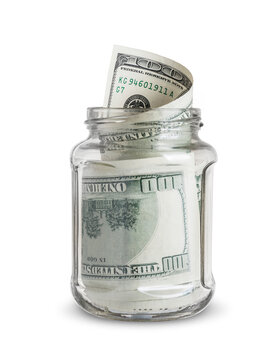 dollar bills in a glass jar isolated