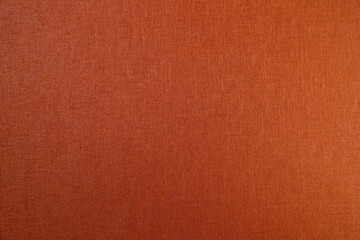 Orange background from natural colored fabric
