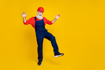 Full size photo of overjoyed positive retired builder long beard red headgear look empty space...