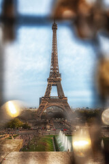 The Eiffel Tower in Paris France, as seen from the Trocadero behind window locks