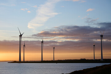 Philipsdam, Zeeland, Netherlands - October 22 2022: Windmills during a beautifull sunrise.