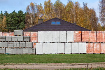 Building materials collected for building a house. Bricks, blocks. Building a house near the city. Poland