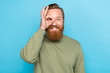 Photo portrait of nice young man hand show okey sign eye glasses fooling dressed stylish khaki look isolated on aquamarine color background