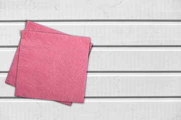 Fabric kitchen tablecloth on the desk background.