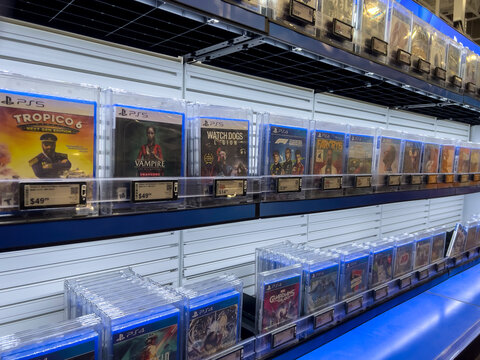 Seattle, WA USA - circa September 2022: Angled, selective focus on Playstation games for sale inside a Best Buy store.