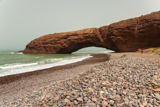 Landscape of Legzira Beach with its natural arches at the coast of Atlantic ocean. Morocco.
