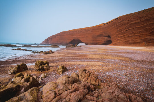 Landscape of Legzira Beach with its natural arches at the coast of Atlantic ocean. Morocco.