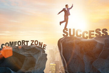 Businessman standing over cliff in the concept