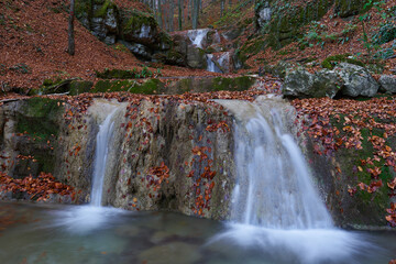 Waterfall in the autumnal forest