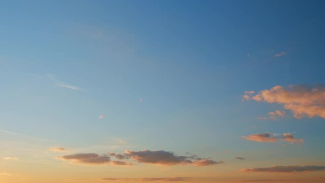 Summer sky at sunset with clouds. Cloudscape in tropical summer sunlight. Timelapse.