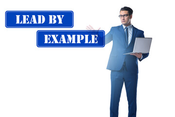 Businessman in lead by example concept