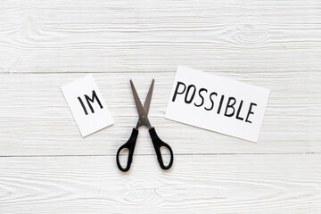 Impossible is possible - word on card. Challenge and motivation concept