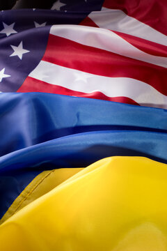 United States of America and Ukrainian flags together on one picture. Ukraine and US Partnership during war of 2022 concept