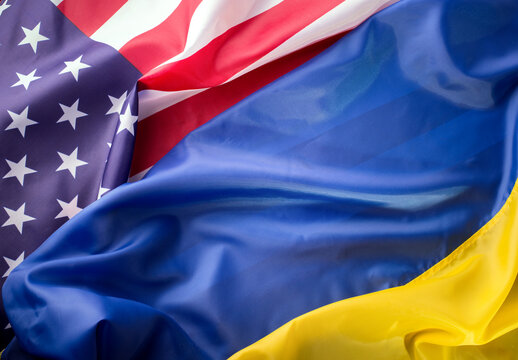 United States of America and Ukrainian flags together on one picture. Ukraine and US Partnership during war of 2022 concept