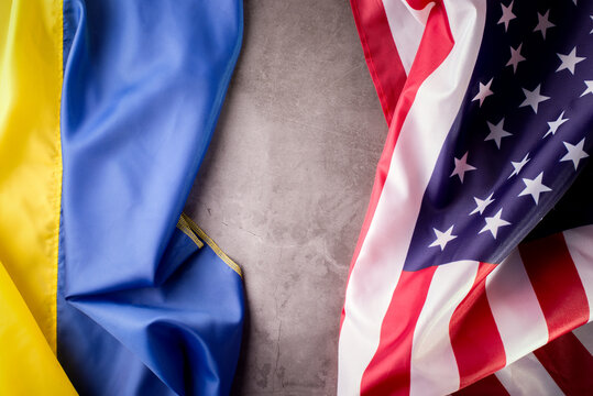 United States of America and Ukrainian flags together on one picture. Ukraine and US Partnership during war of 2022 concept